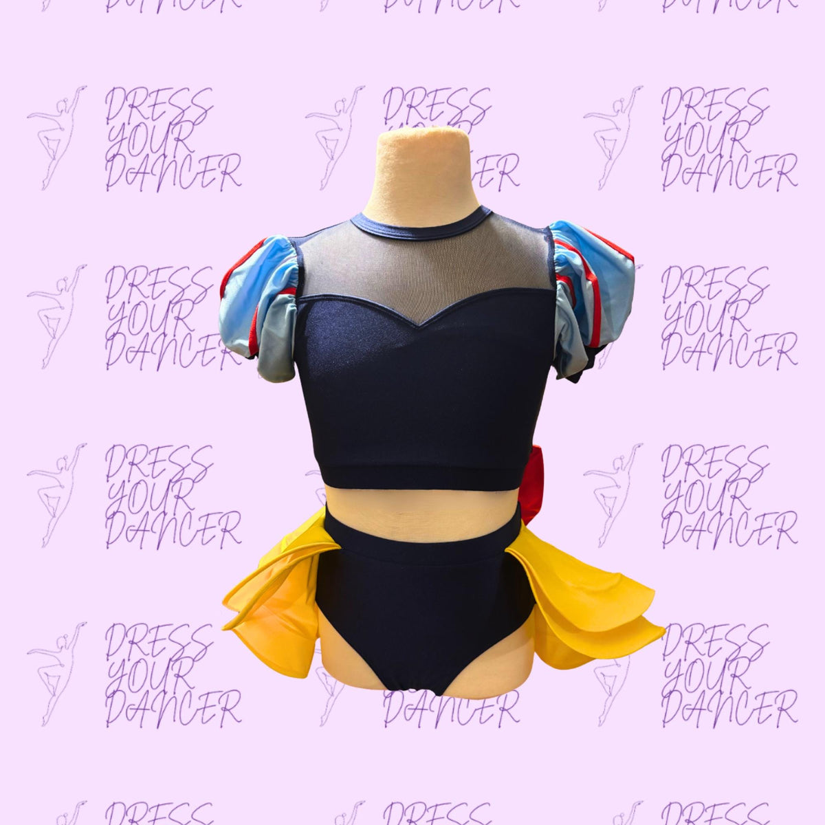 A mannequin wearing a black top with puffed sleeves and a yellow skirt, against a pink background with the text "DRESS YOUR DANCER" repeated multiple times.